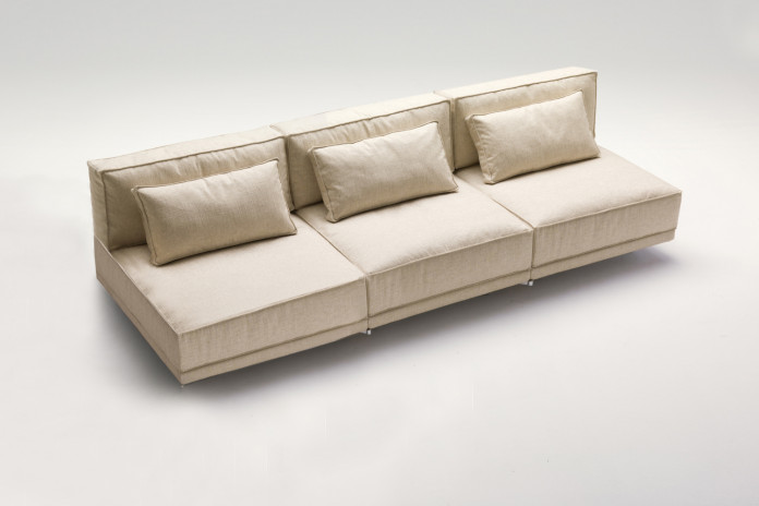 Designer sofa with rotating seats that turns into a bed