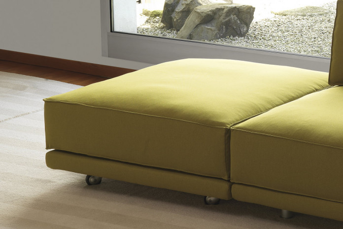 Modern footstool with casters or tubular metal legs