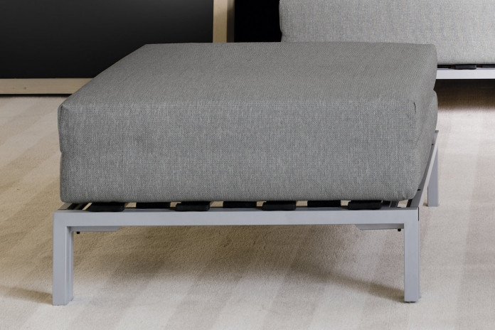 Footstool with metal legs that converts to bed
