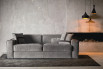 An industrial setting made cozier through a relaxed sofa