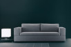 Bench style continuous seat and wide squared arms for a minimalist sofa