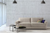 With its flared arms and Italian design, this sofa will add a stylish touch to any home decor