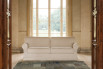 A stylish, timeless classic: rolled arm sofa in white fabric