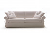 Traditional sock arm 2-3 seater sofa fitted with a skirted cover detailed with ribbons