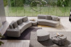 Large sectional sofa made of two 2-seater modules and one low footstool