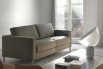 Modern sofa bed with high chrome legs