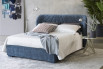 Contemporary winged headboard bed upholstered in fabric, leather, faux leather