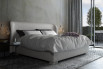 King size winged bed with plain headboard upholstery