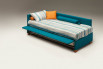 The side frame lifts up to reveal the trundle bed