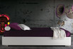 Compact upholstered ottoman bed without headboard