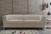 Shelter arm sofa with feather filled cushions and chrome metal legs